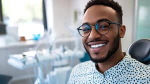Smiling man in an orthodontic clinic.