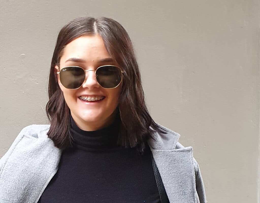 Young woman with metal braces.