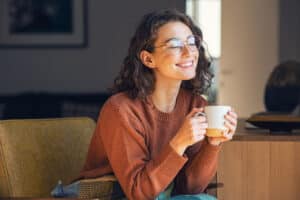 Drinking coffee during Invisalign treatment. Patient has removed aligners.